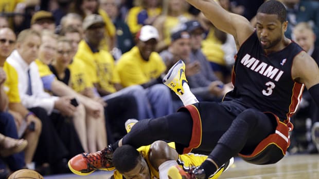 140522192704-paul-george-concussion-dwyane-wade-game-3-single-image-cut.jpg